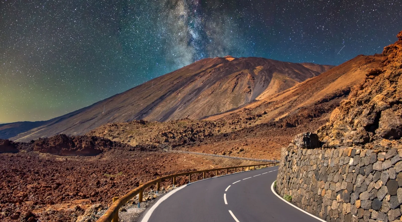 The park road curving toward Mount Teide's cone under a starlit sky