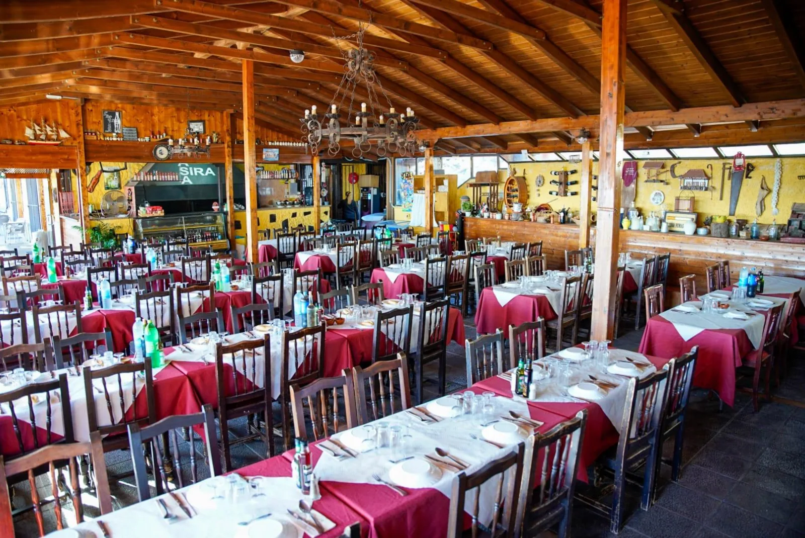 The long tables and timber roof of the mountain restaurant used for the dinner option