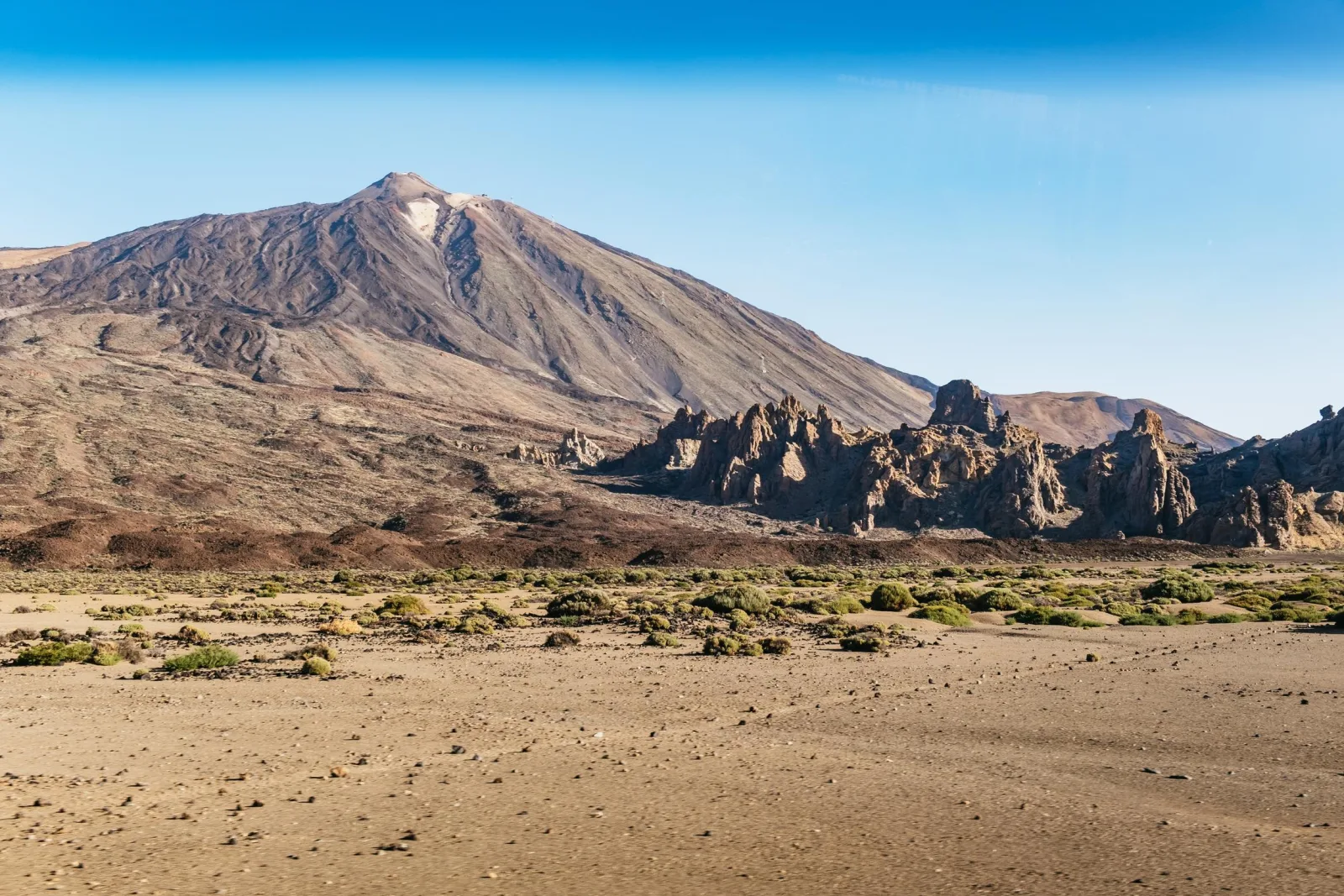 Mount Teide's cone in daylight above the Roques de Garcia and the caldera floor